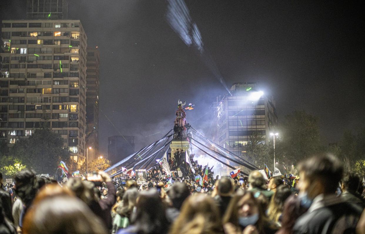 <span class="caption">Chileans celebrate victory after the referendum, in Santiago, Chile, Oct. 25, 2020.</span> <span class="attribution"><a class="link " href="https://www.gettyimages.com/detail/news-photo/people-gather-to-celebrate-the-victory-of-the-referendum-in-news-photo/1229286678?adppopup=true" rel="nofollow noopener" target="_blank" data-ylk="slk:Felipe Vargas Figueroa/NurPhoto via Getty Images;elm:context_link;itc:0;sec:content-canvas">Felipe Vargas Figueroa/NurPhoto via Getty Images</a></span>