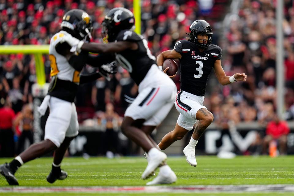 Cincinnati Bearcats quarterback Evan Prater (3) finds a hole on his way to a touchdown carry in the fourth quarter of the NCAA football game between the Cincinnati Bearcats and the Kennesaw State Owls at Nippert Stadium in Cincinnati on Saturday, Sept. 10, 2022. The Bearcats extended the nation’s second-longest home winning streak to 28 and advanced to 1-1 with a 63-10 win. 