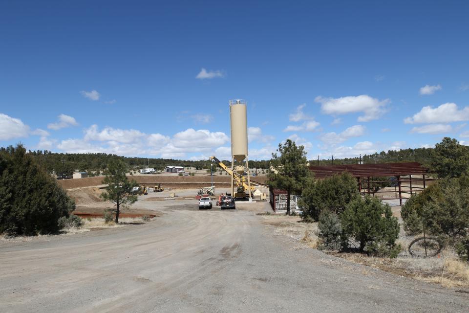 A silo at Roper Construction's concrete batch plant blocks a mountainous view from the property of Pete Blanchard, March 27, 2024 in Alto.