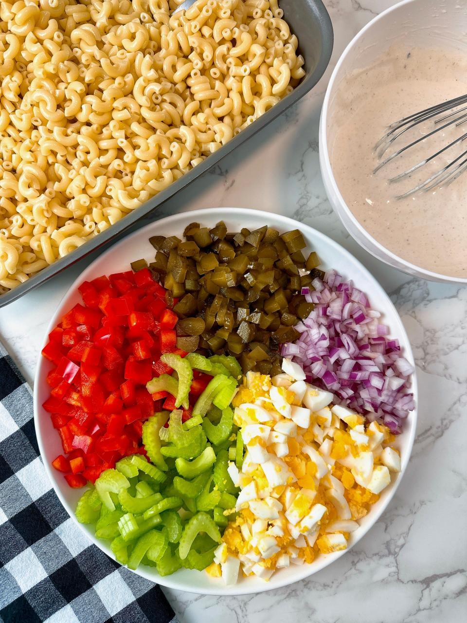 There are endless ways to customize your mac salad, from swapping egg for cheese to adding different colors of bell pepper.