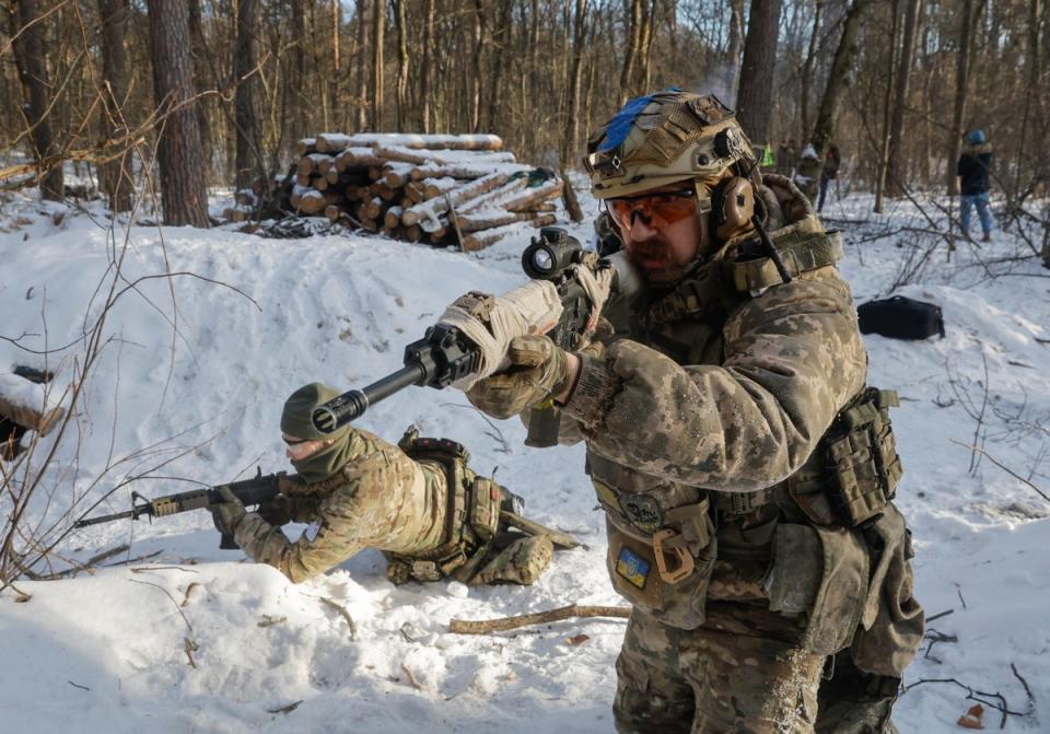 Ukrainian civilians attend their final military training after a five-day course near Kyiv, Ukraine, 12 January 2024 (EPA)