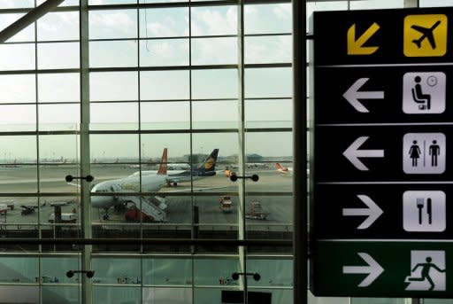 This file photo shows aeroplanes, seen from within the domestic departure terminal at the Indira Gandhi International Airport in New Delhi. Passengers are understandably anxious about the idea of a semi-trained fraudster pilot being responsible for their lives