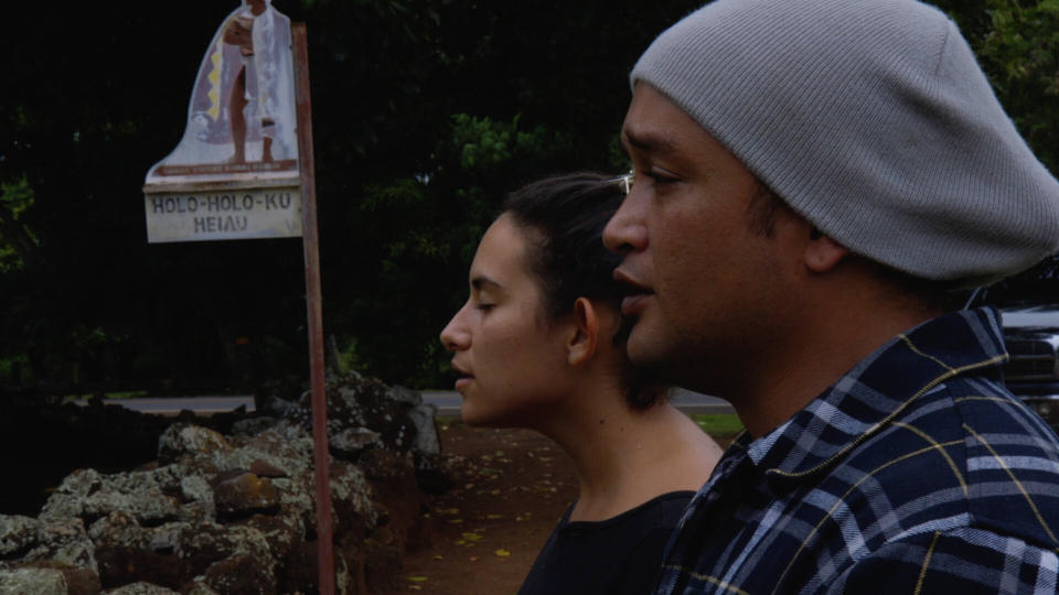 In a scene from the documentary "Cane Fire," Ke&rsquo;ala Lopez and Kamu &ldquo;Charles&rdquo; Hepa lead a Hawaiian chant before a sacred burial site in the Wailua Valley. (Photo: Courtesy of Anthony Banua-Simon)