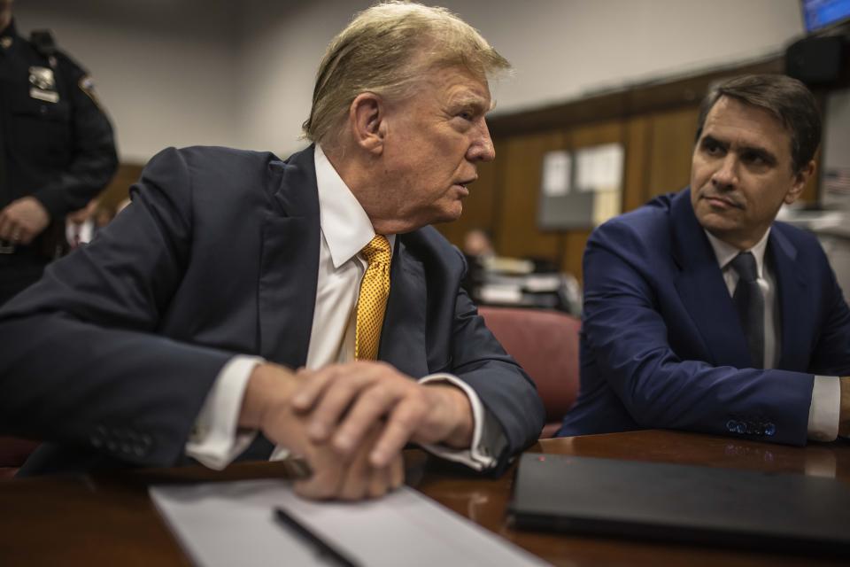 Former President Donald Trump sits in a courtroom next to his lawyer Todd Blanche before the start of the day's proceedings in the Manhattan Criminal court, Tuesday, May 21, 2024, in New York. (Dave Sanders/The New York Times via AP, Pool)