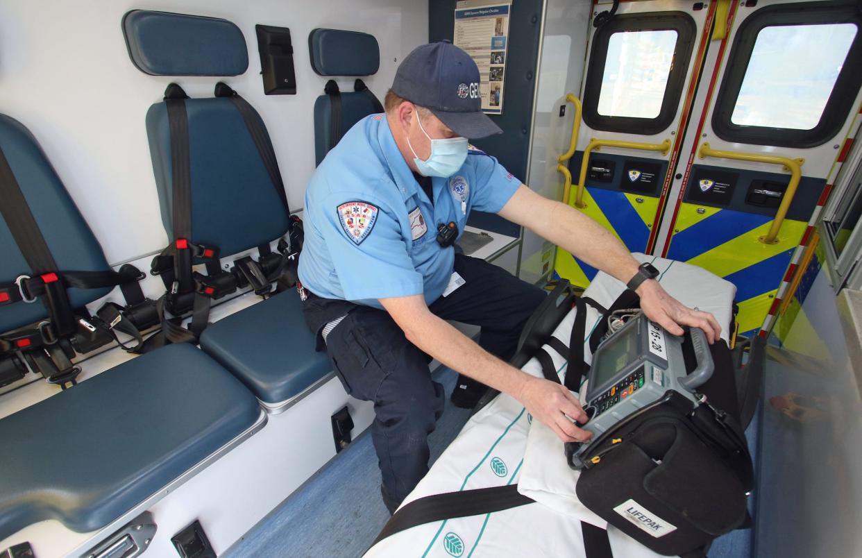 Paramedic Jason Stowe checks equipment at Gaston County Emergency Medical Services on North Highland St. Tuesday morning, Jan. 25, 2022.