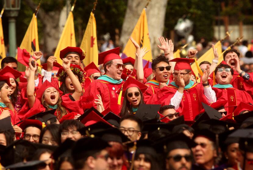 LOS ANGELES, CA - MAY 12, 2023 - USC graduates cheer at the University of Southern California's 140th commencement ceremony in Los Angeles on May 12, 2023. Producer and president of Marvel Studies Kevin Feige delivered the commencement address. Feige, along with Frances Arnold and labor leader and civil rights activist Dolores Huerta received honorary degrees. (Genaro Molina / Los Angeles Times)
