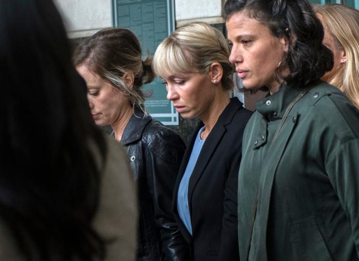 Sherri Papini, center, leaves her sentencing hearing at the Robert T. Matsui U.S. Courthouse and Federal Building in downtown Sacramento on Monday, September 19, 2022. Senior U.S. District Judge William B. Shubb sentenced Papini to 18 months in federal prison for faking her kidnapping in 2016. The judge said he gave Papini a longer sentence to prevent others from committing similar crimes.