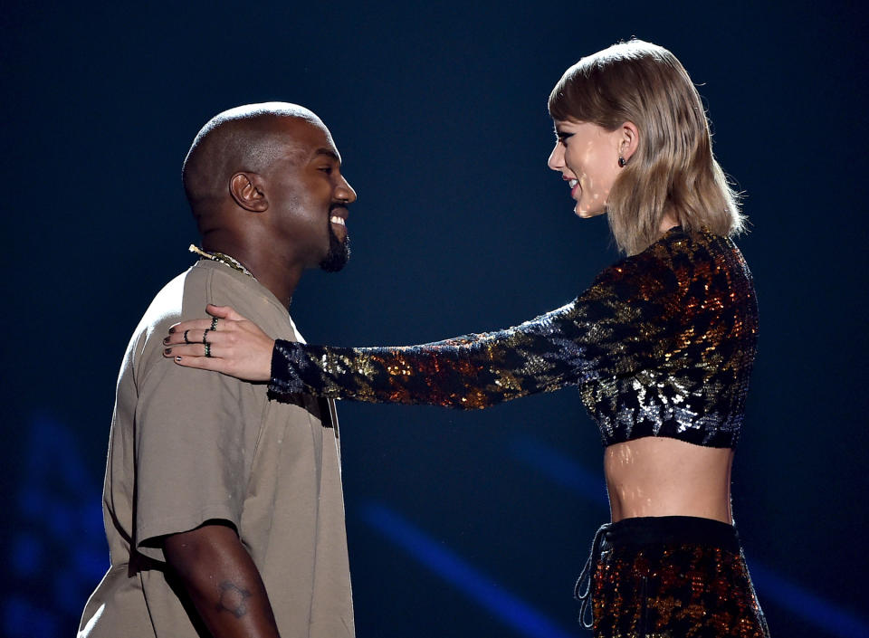 LOS ANGELES, CA - AUGUST 30:  Recording artist Kanye West (L) accepts the Video Vanguard Award from recording artist Taylor Swift onstage during the 2015 MTV Video Music Awards at Microsoft Theater on August 30, 2015 in Los Angeles, California.  (Photo by Kevin Winter/MTV1415/Getty Images For MTV)