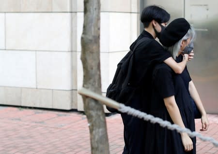 Protesters gather to support protesters who have been charged with rioting and are to stand trial at the Eastern Magistrates' Court in Kowloon, Hong Kong