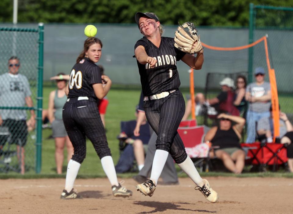 Watkins Memorial's Hannah Hunt throws out a Westerville Central baserunner at first during a Division I district final game May 20 at Pickerington High School Central.