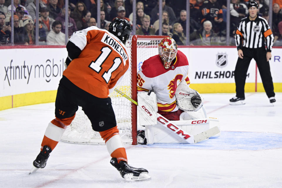 Calgary Flames goaltender Jacob Markstrom makes a save on a shot from Philadelphia Flyers' Travis Konecny (11) during the second period of an NHL hockey game, Saturday, Jan. 6, 2024, in Philadelphia. (AP Photo/Derik Hamilton)