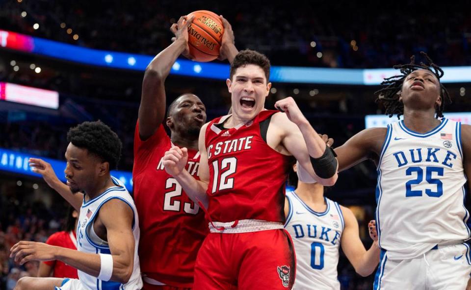 N.C. State’s Mohamed Diarra (23) secures the final defensive rebound as the clock expires, and teammate Michael O’Connell (12) begins the celebration of the Wolfpack’s 79-64 victory over Duke in the quarterfinals of the ACC Men’s Basketball Tournament at Capitol One Arena on Wednesday, March 13, 2024 in Washington, D.C. Robert Willett/rwillett@newsobserver.com