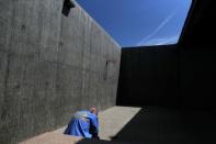 An inmate sits in the yard of a cellblock which mainly houses prisoners with cognitive decline, Alzheimer's, and dementia, at the California Health Care Facility in Stockton, California, U.S., May 24, 2018. REUTERS/Lucy Nicholson