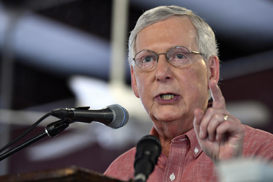 FILE - In this Saturday, Aug. 3, 2019 file photo, Senate Majority Leader Mitch McConnell, R-Ky., addresses the audience gathered at the Fancy Farm Picnic in Fancy Farm, Ky. Democrat Amy McGrath’s Senate campaign missed a deadline, Friday, Sept. 6, 2019 set by an attorney seeking a reply to demands from two retired Kentucky coal miners that their images be removed from a campaign ad attacking Senate Majority Leader Mitch McConnell. McGrath’s campaign claims both men signed a form giving their permission to appear in the ad. (AP Photo/Timothy D. Easley, File)