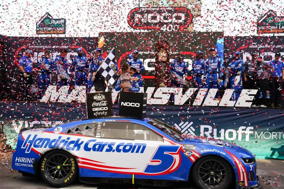 Apr 16, 2023; Martinsville, Virginia, USA; NASCAR Cup Series driver Kyle Larson (5) celebrates in victory lane with his children Owen Larson and Audrey Layne Larson after winning the NOCO 400 at Martinsville Speedway. Mandatory Credit: John David Mercer-USA TODAY Sports John David Mercer/John David Mercer-USA TODAY Spor