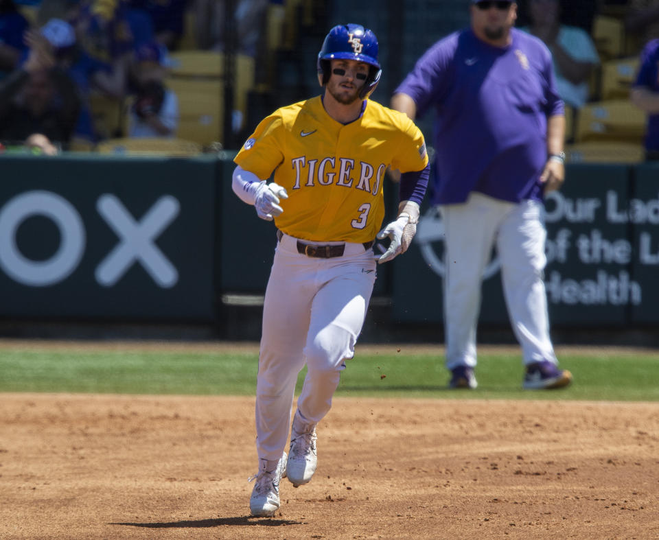 LSU center fielder Dylan Crews (3) rounds the bases following his third inning home run against Alabama in an NCAA college baseball game on Sunday, April 30, 2023, at Alex Box Stadium in Baton Rouge, Louisiana. The LSU Tigers enter the NCAA baseball tournament with the top two prospects in this summer's major baseball draft spearheading their postseason push. Centerfielder Dylan Crews is hitting .420 and was named the SEC player of the year. He's the consensus top prospect in this July's amateur draft. Next is 6-foot-6, 247-pound pitcher and Air Force transfer Paul Skenes. The righty throws 100 miles per hour, leads the nation with 167 strikeouts and was named SEC pitcher of the year. (Michael Johnson/The Times-Picayune/The New Orleans Advocate via AP)