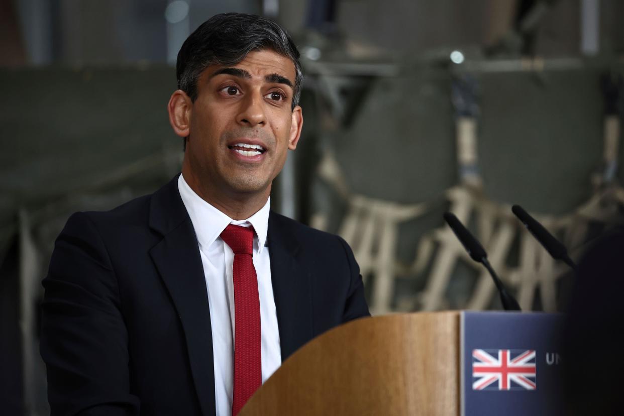 Britain's Prime Minister Rishi Sunak addresses a press conference with the NATO Secretary General at the Warsaw Armoured Brigade in Warsaw, Poland, on Tuesday April 23, 2024. (Henry Nicholls, Pool Photo via AP)