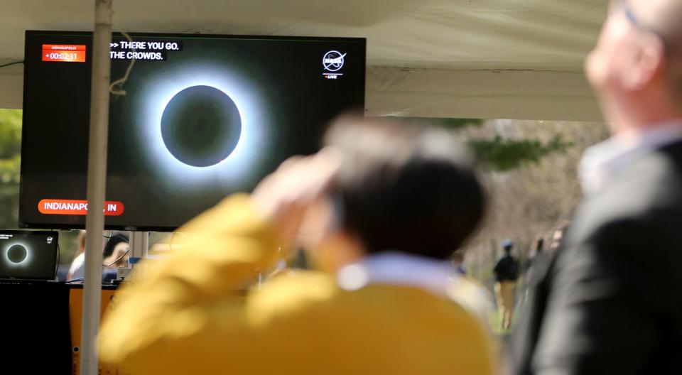 The video feed from NASA shows Indianapolis in totality Monday, April 8, 2024, at the solar eclipse watch party on the Irish Green at the University of Notre Dame in South Bend.