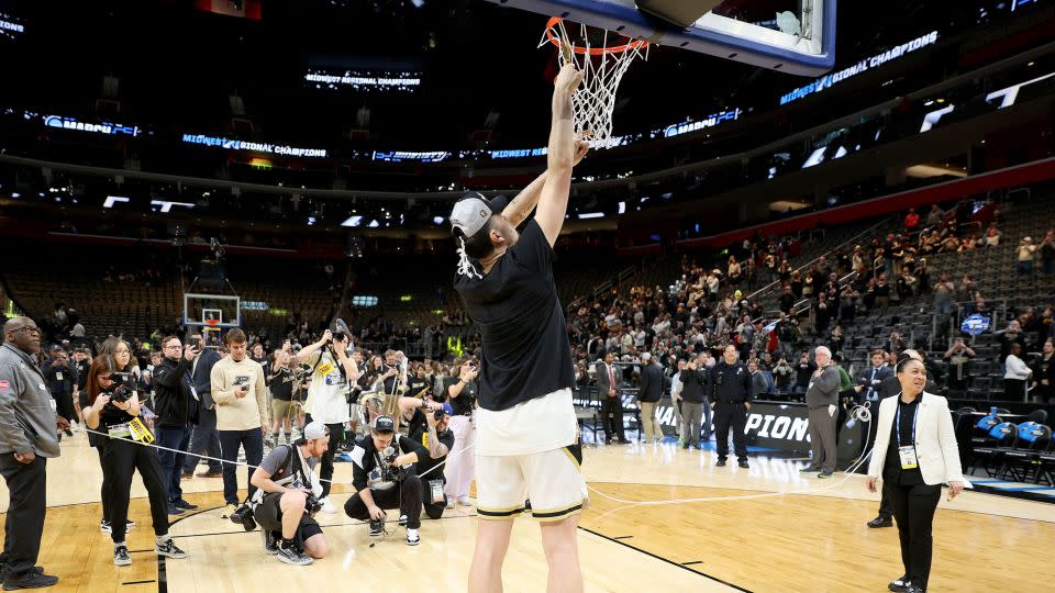 Zach Edey of Purdue cuts down the net after defeating the Tennessee Volunteers in the Elite 8. - Mike Mulholland/Getty Images