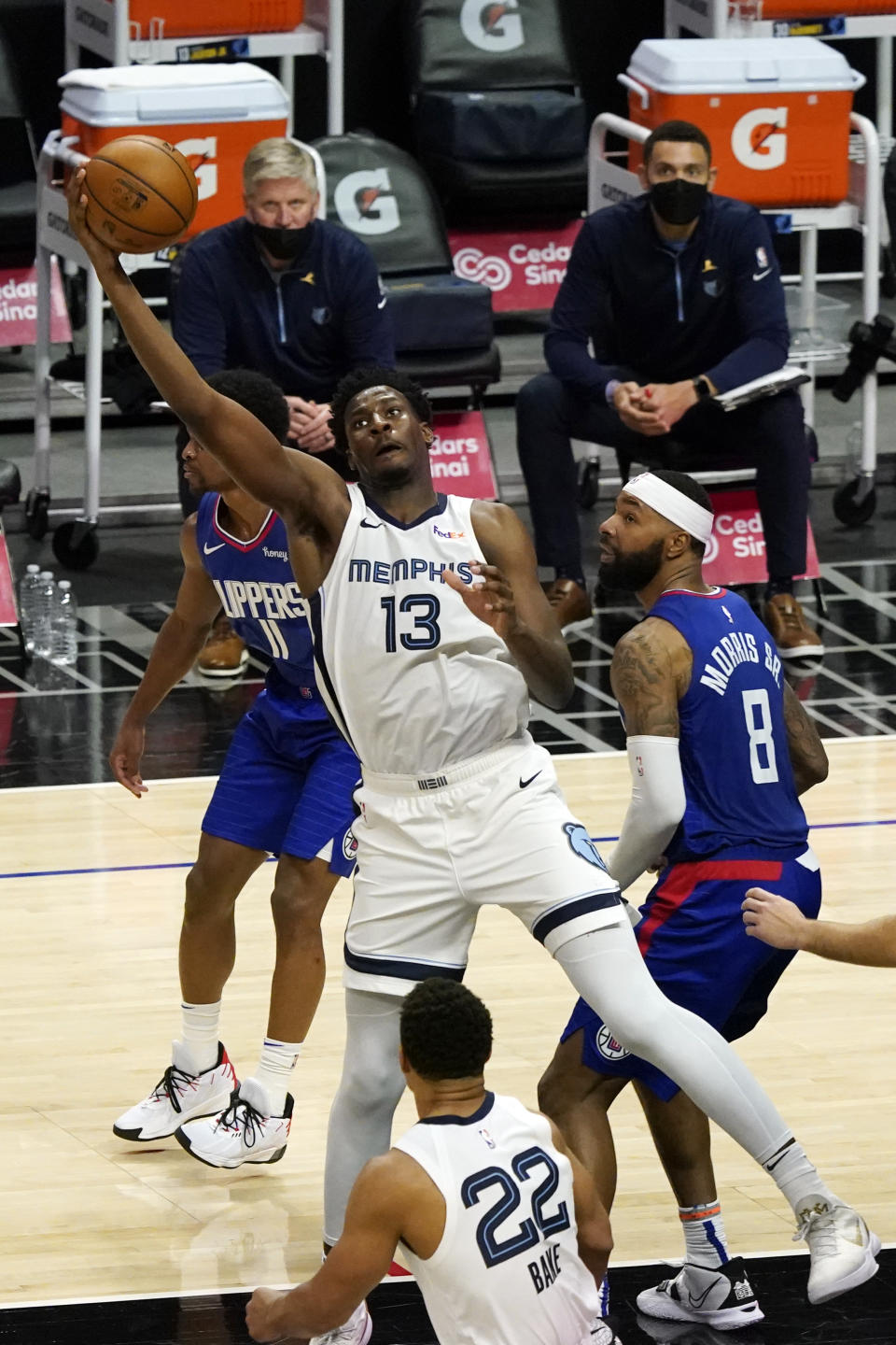 Memphis Grizzlies forward Jaren Jackson Jr. (13) grabs a high pass next to Los Angeles Clippers forward Marcus Morris Sr. (8) during the second half of an NBA basketball game Wednesday, April 21, 2021, in Los Angeles. (AP Photo/Marcio Jose Sanchez)