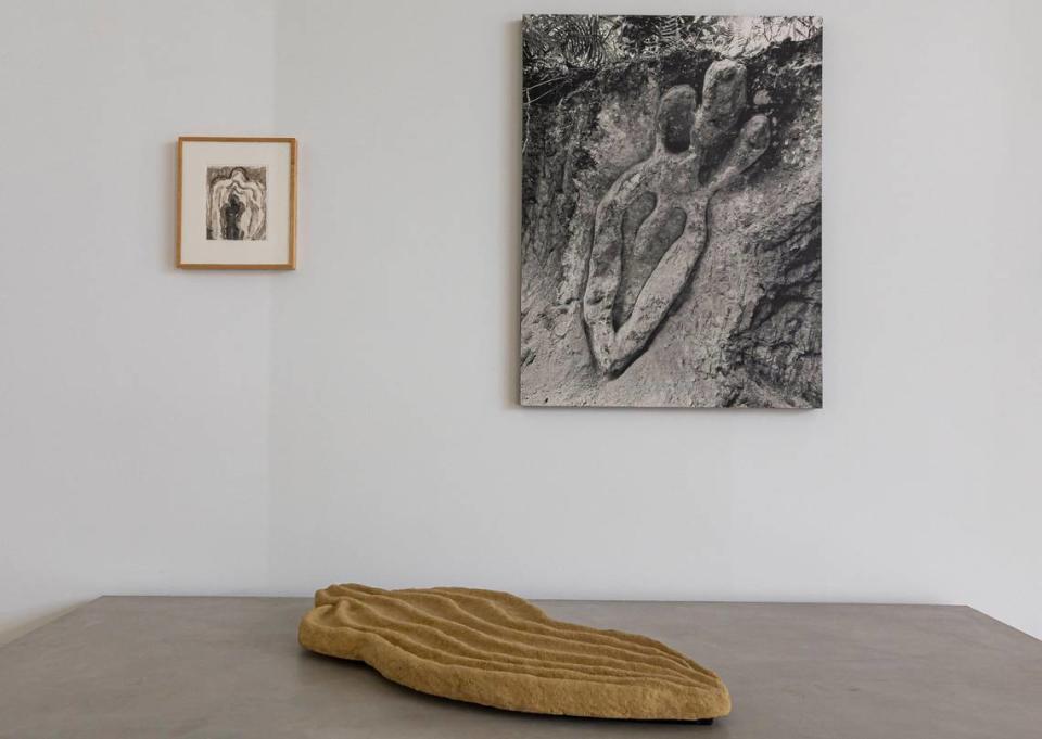 Artwork by Ana Mendieta are on display at the de la Cruz Collection on Monday, April 8, 2024, in Miami, Florida. The “Sandwoman” sculpture was sold in auction at Christie’s on May 14, 2024, for $567,025, including fees. The black-and-white print sold for $130,000, not including fees.