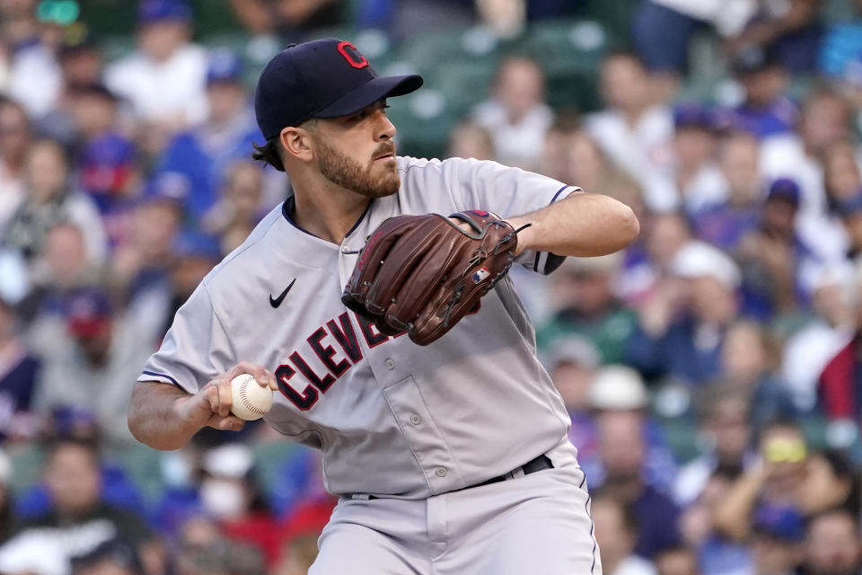 Cleveland Indians starting pitcher Aaron Civale winds up during the first inning of a baseball game against the Chicago Cubs, Monday, June 21, 2021, in Chicago. (AP Photo/Charles Rex Arbogast)