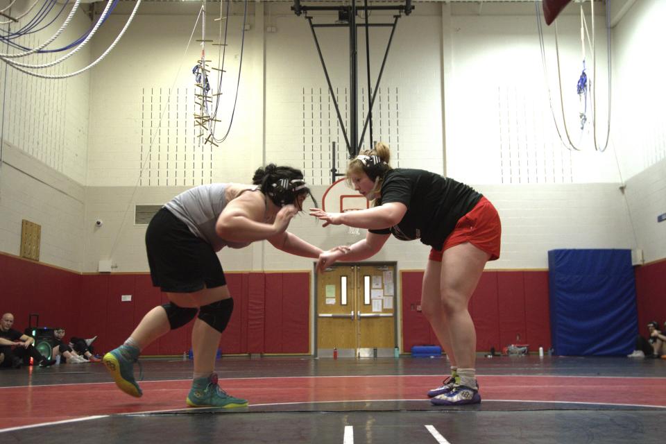 Aja'nail Jumper, right, wrestles during a Cumberland Valley High School team practice Tuesday, Feb. 27, 2024, in Mechanicsburg, Pa. Jumper, a senior, began wrestling three years ago after the school started a girls team. Before that, her parents had not wanted her to wrestle boys. (AP Photo/Marc Levy)