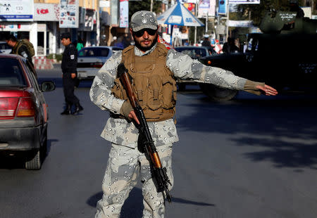 Afghan police stand guard at a checkpoint during the parliamentary election in Kabul, Afghanistan October 21, 2018. REUTERS/Omar Sobhani