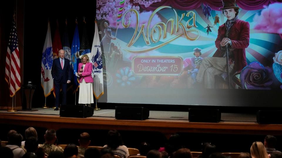 President Joe Biden listen as first lady Jill Biden speaks before a screening of the movie 