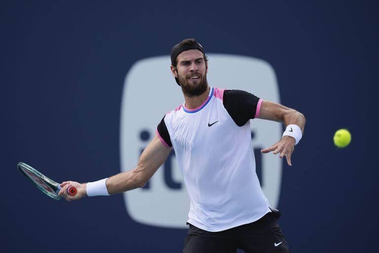 Karen Khachanov returns a ball from Francisco Cerundolo, of Argentina, in their men's third round match at the Miami Open tennis tournament, Monday, March 25, 2024, in Miami Gardens, Fla. (AP Photo/Rebecca Blackwell)