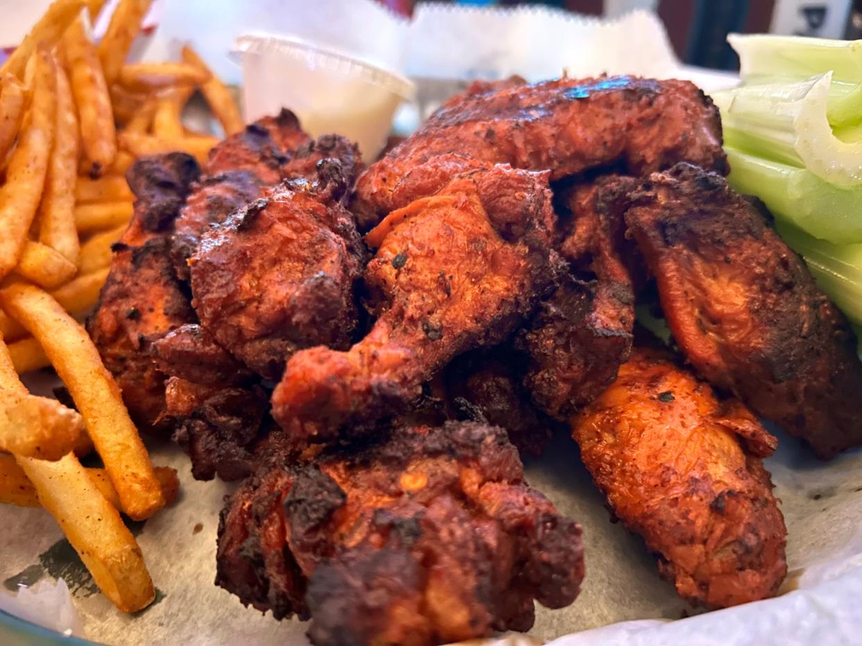 The chicken wings at Club Garibaldi in Bay View are marinated first, then cooked on the grill for a crispy, smoky finish.