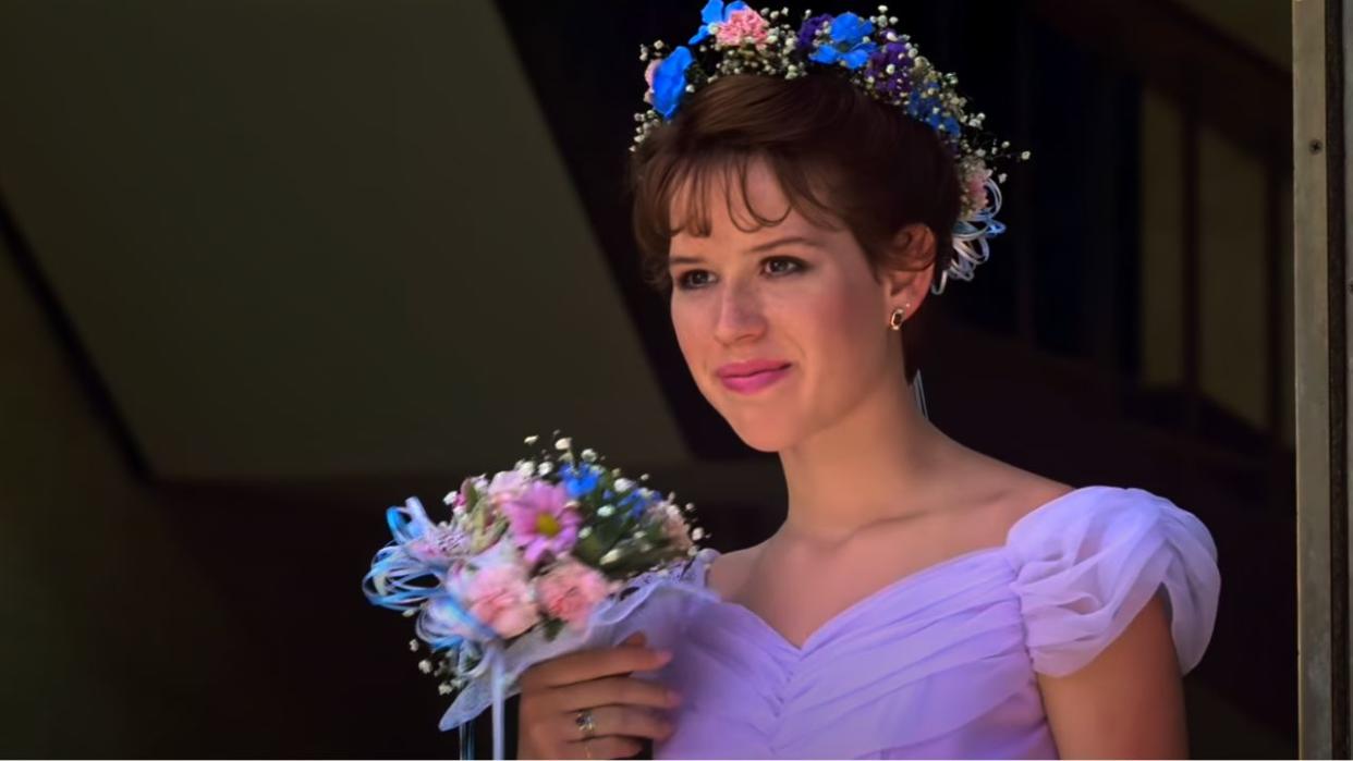  Molly Ringwald as Sam wearing the purple bridemaids dress at the end of Sixteen Candles. 