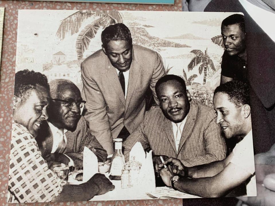 Dr. Martin Luther King Jr. dines at the Hampton House cafe in the early 1960s.