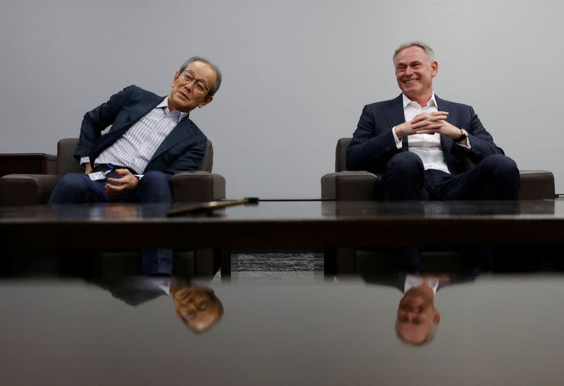 Olympus Corp current chief executive Yasuo Takeuchi and incoming chief executive Stefan Kaufmann attend an interview with Reuters in Tokyo