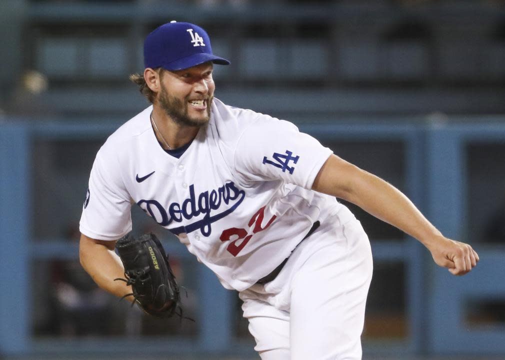 Dodgers starting pitcher Clayton Kershaw follows through after delivering a pitch.