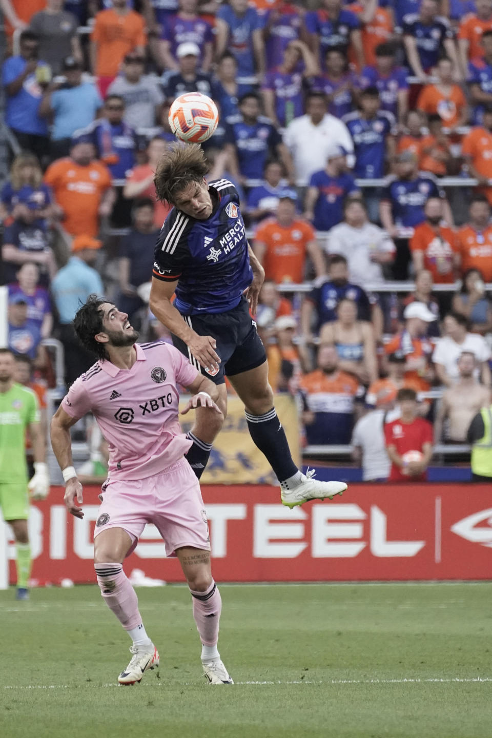 FC Cincinnati defender Nick Hagglund, top, goes up for the ball aover Inter Miami forward Leonardo Campana during the first half of a U.S. Open Cup soccer semifinal Wednesday, Aug. 23, 2023, in Cincinnati. (AP Photo/Joshua A. Bickel)