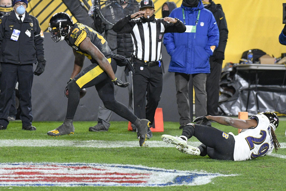 Pittsburgh Steelers wide receiver JuJu Smith-Schuster (19) celebrates after a touchdown catch next to Baltimore Ravens cornerback Tramon Williams during the second half of an NFL football game Wednesday, Dec. 2, 2020, in Pittsburgh. (AP Photo/Don Wright)