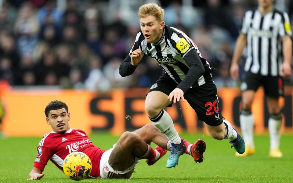 Nottingham Forest's Morgan Gibbs-White challenges Newcastle United's Lewis Hall
