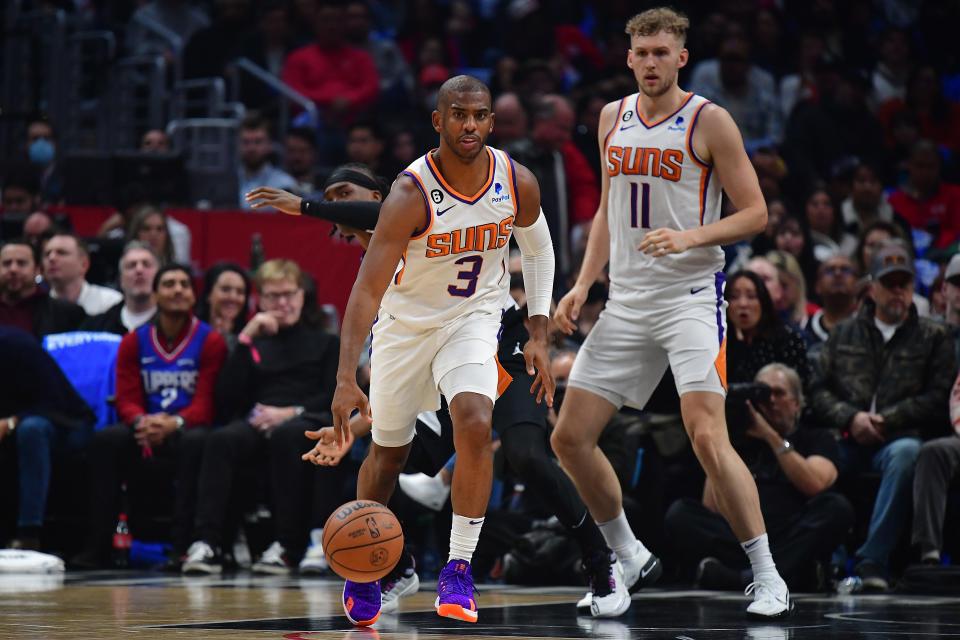 Dec 15, 2022; Los Angeles, California, USA; Phoenix Suns guard Chris Paul (3) controls the ball against the Los Angeles Clippers during the first half at Crypto.com Arena. Mandatory Credit: Gary A. Vasquez-USA TODAY Sports