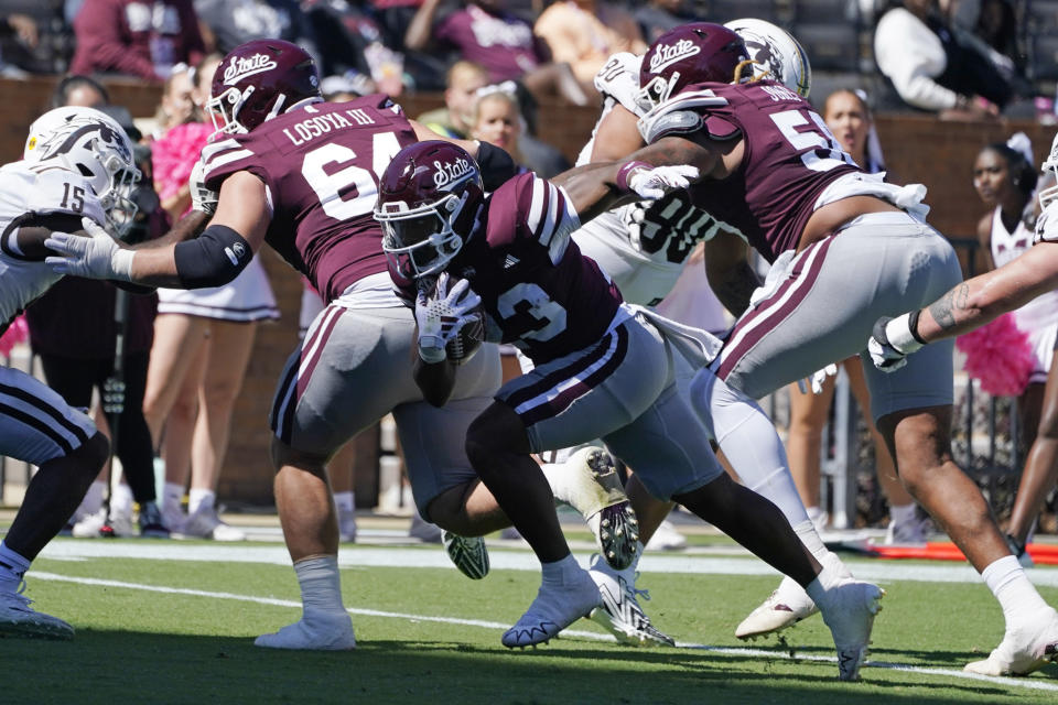 CORRECTS SCORE - Mississippi State running back Seth Davis (23) runs past blockers on his way to a 5-yard touchdown run during second half of an NCAA college football game against Western Michigan, Saturday, Oct. 7, 2023, in Starkville, Miss. Mississippi State won 41-28. (AP Photo/Rogelio V. Solis)