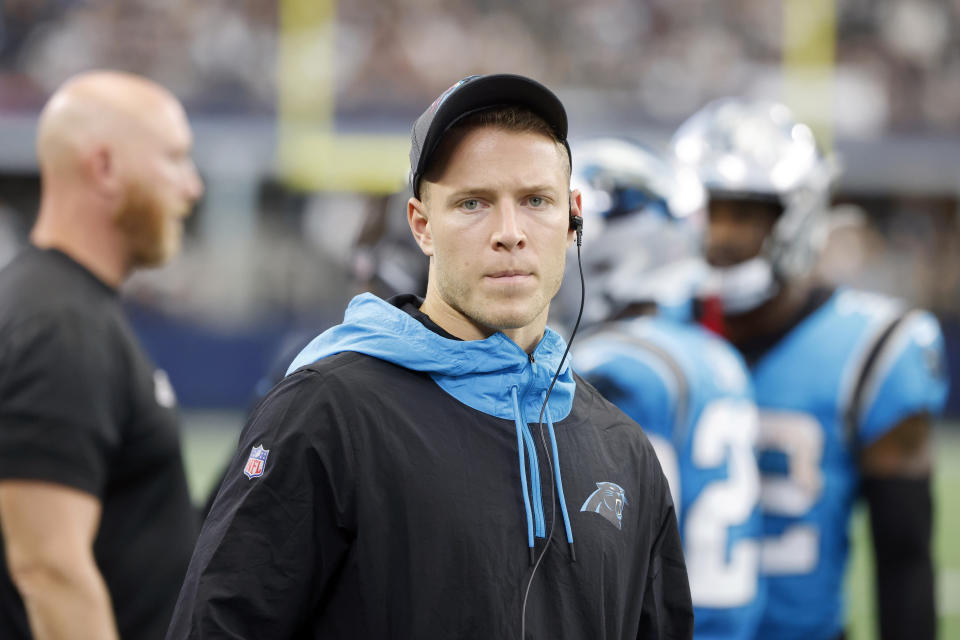 FILE - In this Sunday, Oct. 3, 2021, file photo, Carolina Panthers running back Christian McCaffrey watches play from the sideline during the first half of a NFL football game against the Dallas Cowboys in Arlington, Texas. McCaffrey did not practice Thursday, Oct. 14, 2021, a sign that he could miss his third straight game while trying to rehab from a hamstring injury. (AP Photo/Michael Ainsworth)