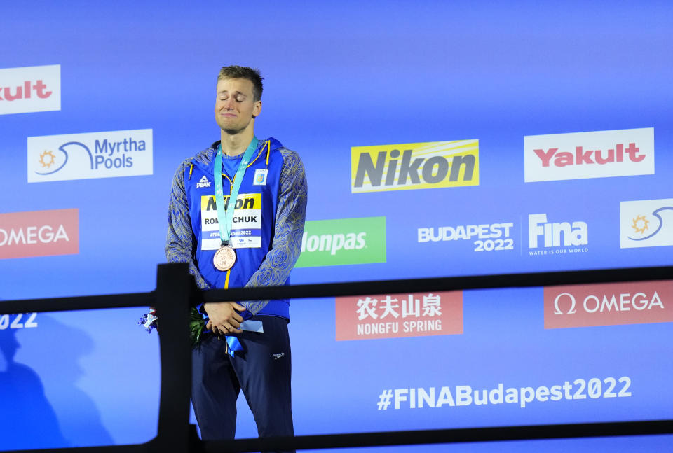 Mykhailo Romanchuk of Ukraine reacts after winning bronze medal in the Men 800m Freestyle final at the 19th FINA World Championships in Budapest, Hungary, Tuesday, June 21, 2022. (AP Photo/Petr David Josek)
