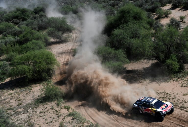 Peugeot's Spanish drivers Carlos Sainz and co-driver Lucas Cruz compete during Stage 13 of the 2018 Dakar Rally between San Juan and Cordoba, Argentina, on January 19, 2018