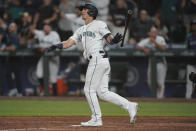 Seattle Mariners' Dylan Moore watches his grand slam during the eighth inning of a baseball game against the Houston Astros, Monday, July 26, 2021, in Seattle. (AP Photo/Ted S. Warren)