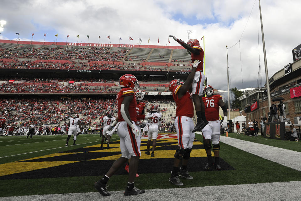 Maryland wide receiver Tai Felton, right, is raised in the air by offensive lineman Delmar Glaze and celebrates his touchdown during the first half of an NCAA college football game against Indiana, Saturday, Sept. 30, 2023, in College Park, Md. (AP Photo/Terrance Williams)