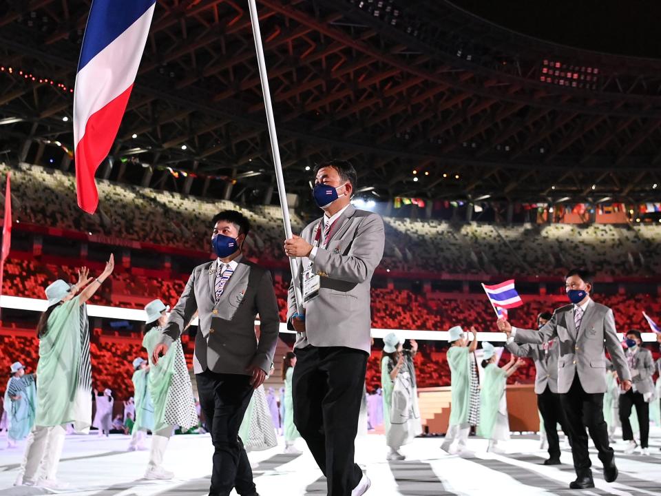 thailand olympic team entering opening ceremony at tokyo games