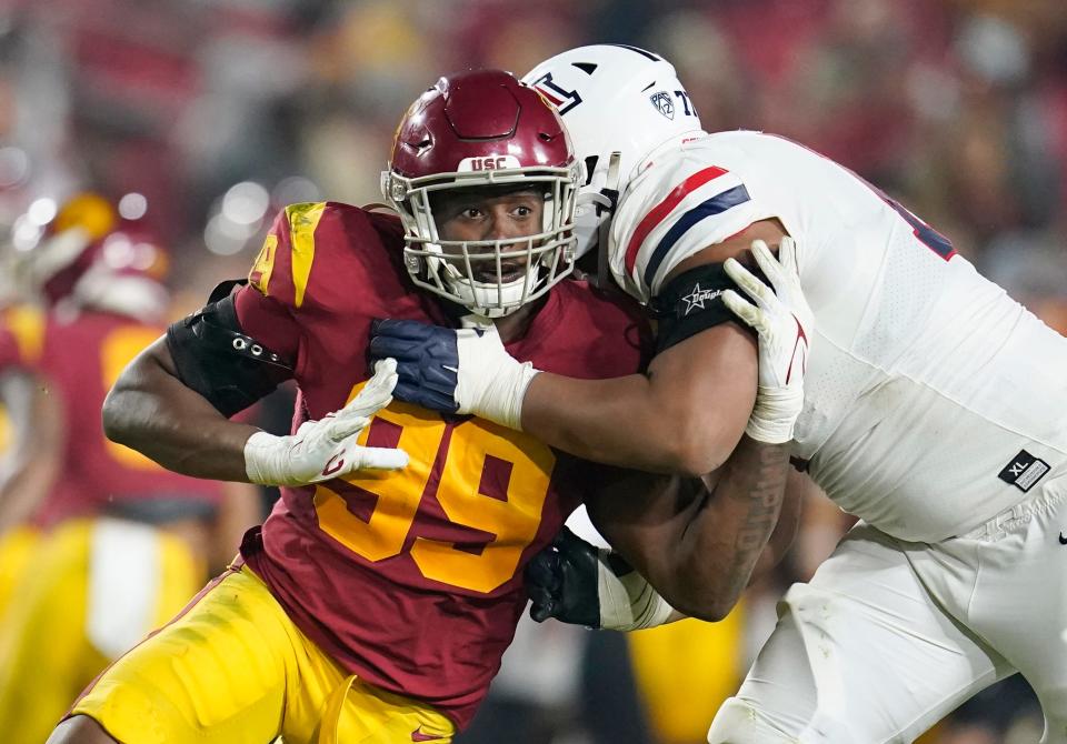 FILE - Southern California linebacker Drake Jackson (99) tries to pass-rush around the block from Arizona offensive lineman Jordan Morgan during the second half of an NCAA college football game Oct. 30, 2021, in Los Angeles. Jackson was selected by the San Francisco 49ers during the second round of the NFL draft Friday, April 29. (AP Photo/Marcio Jose Sanchez, File)