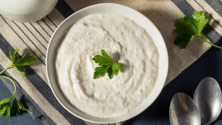 Creamy horseradish in a bowl with garnish