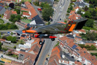 An OV-10 Bronco aircraft, decorated with World War One commemoration motifs, flies over Flanders international airport, ahead of the world's first Short Take Off & Landing competition on sand, in Wevelgem, Belgium May 8, 2018. REUTERS/Francois Lenoir