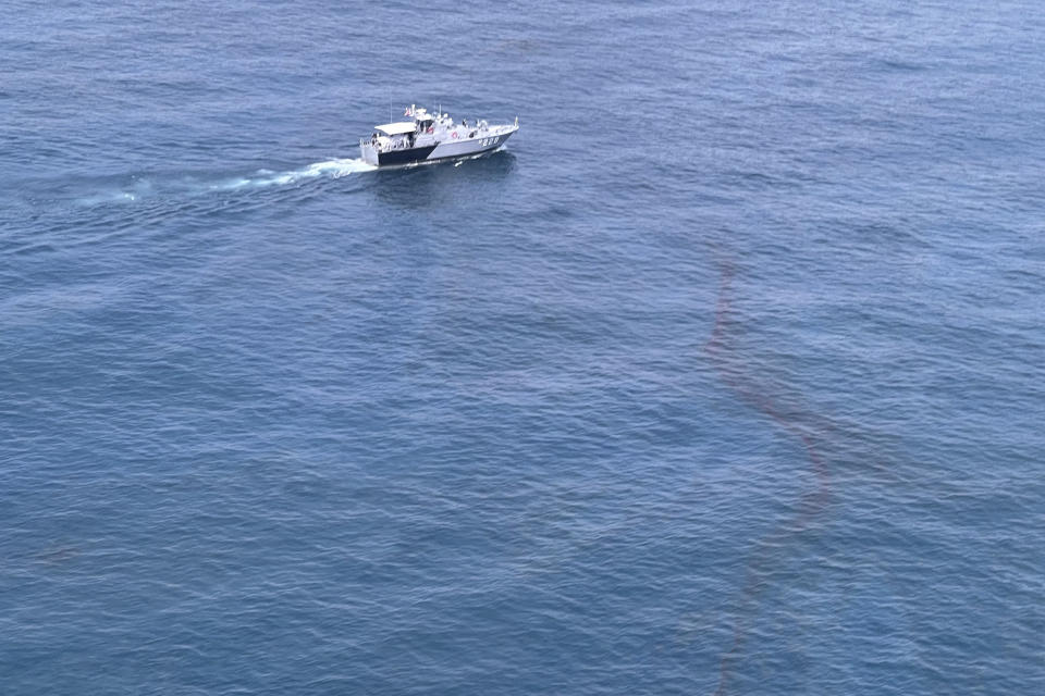 In this photo released by the Royal Thai Navy, an aerial view from a navy plane shows a large oil spill off the coast of Rayong, eastern Thailand, Thursday, Jan. 27, 2022. A special aircraft from a company specializing in recoveries from oil spills has arrived Thursday from Singapore to join an urgent effort to clean up an oil slick before it could hit beaches in eastern Thailand. (Royal Thai Navy via AP)